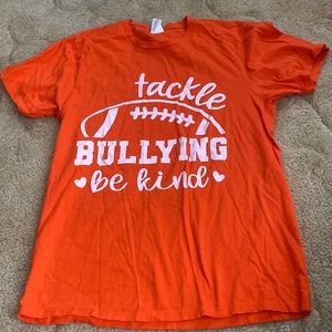 Men’s size small tackle bullying , be kind short sleeve color orange